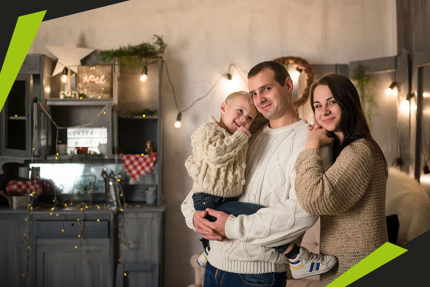 Father, Mother And Son In Stylish Loft Interior. Evening Christm
